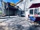 Backyard patio area for entertaining with second story deck and outdoor dining set at 4436 Old Country Way, Snellville, GA 30039