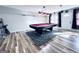 Finished basement with a pool table, unique flooring and a bar at 4436 Old Country Way, Snellville, GA 30039