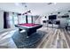 Finished basement with pool table, bar area, and unique flooring at 4436 Old Country Way, Snellville, GA 30039