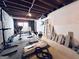 Unfinished basement space with weights, and workout equipment at 4436 Old Country Way, Snellville, GA 30039