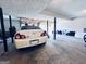 Spacious unfinished basement with car parked inside and overhead garage door at 4436 Old Country Way, Snellville, GA 30039