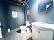Bathroom featuring grey walls, white vanity, toilet and medicine cabinet mirror at 4436 Old Country Way, Snellville, GA 30039