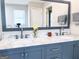 Bathroom featuring a dual sink vanity, a marble countertop, and modern faucets and hardware at 4436 Old Country Way, Snellville, GA 30039