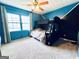 Cozy blue bedroom featuring a bunk bed, carpeted floor, and large windows at 4436 Old Country Way, Snellville, GA 30039