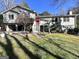 Charming two-story home featuring an inviting red front door and well-maintained yard, with a convenient attached two-car garage at 4436 Old Country Way, Snellville, GA 30039