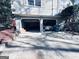 Garage exterior showing a driveway and mature landscaping at 4436 Old Country Way, Snellville, GA 30039