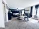 Spacious main bedroom features a sitting area, ceiling fan, and large windows providing natural light at 4436 Old Country Way, Snellville, GA 30039