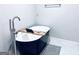 Contemporary soaking tub with mounted faucet, tray and gray rug at 4436 Old Country Way, Snellville, GA 30039
