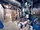 View of a unfinished storage room with mechanicals, and storage boxes at 4436 Old Country Way, Snellville, GA 30039