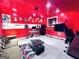 Recording studio with red walls, a monitor, keyboard, desk, and couch at 4436 Old Country Way, Snellville, GA 30039