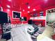 Recording studio with red walls, a monitor, keyboard, desk, and couch at 4436 Old Country Way, Snellville, GA 30039