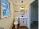 Updated half-bathroom with natural light and modern fixtures at 3280 Gum Creek Rd, Oxford, GA 30054