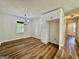 Bright dining room featuring hardwood floors, modern chandelier, and updated white cabinets at 3280 Gum Creek Rd, Oxford, GA 30054