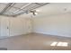 Spacious two car garage with epoxy floor, multiple doors, automatic opener, and bright lighting at 3280 Gum Creek Rd, Oxford, GA 30054