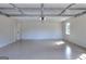 Large two car garage with epoxy floor, automatic door, and bright lighting at 3280 Gum Creek Rd, Oxford, GA 30054