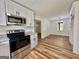 Stylish kitchen featuring granite countertops, and stainless steel oven and microwave at 3280 Gum Creek Rd, Oxford, GA 30054