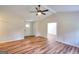 Bright living room featuring wood-look floors, ceiling fan, and neutral paint at 3280 Gum Creek Rd, Oxford, GA 30054