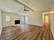 Inviting living room featuring a fireplace, wood floors, and a vaulted ceiling at 3280 Gum Creek Rd, Oxford, GA 30054