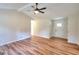 Open living space with wood-look floors, neutral walls, and a ceiling fan at 3280 Gum Creek Rd, Oxford, GA 30054