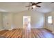 Bright, open living room with wood flooring, neutral walls, and doorway views at 3280 Gum Creek Rd, Oxford, GA 30054