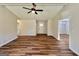 Inviting living room with wood-look floors, white trim, and lots of natural light at 3280 Gum Creek Rd, Oxford, GA 30054