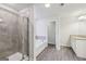 A modern bathroom with a glass shower, a tub, and double vanity at 3725 Heron Creek Ct, Loganville, GA 30052