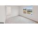 Bright bedroom with walk-in closet and large window overlooking construction site at 3725 Heron Creek Ct, Loganville, GA 30052