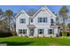 Charming two-story home with light-blue siding, a well-kept lawn, and classic blue shutters at 3725 Heron Creek Ct, Loganville, GA 30052