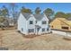Two-story new construction home featuring blue siding, shutters, and landscaping at 3725 Heron Creek Ct, Loganville, GA 30052