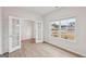 Cozy room with glass panel french doors and a large window with a view of the yard at 3725 Heron Creek Ct, Loganville, GA 30052