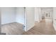 Bright, open-concept living area featuring light-colored floors, fresh paint, and ample natural light at 3725 Heron Creek Ct, Loganville, GA 30052