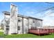 Two-story home featuring a large wooden deck and a well-maintained green lawn at 5105 Cascade Hills Cir, Atlanta, GA 30331