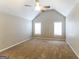 Spacious bedroom with vaulted ceilings, carpeted floors, and dual windows for natural light at 5105 Cascade Hills Cir, Atlanta, GA 30331