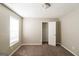 Comfortable bedroom with neutral tones, soft carpet, and a closet with ample storage space at 5105 Cascade Hills Cir, Atlanta, GA 30331