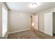Inviting bedroom featuring neutral walls, soft carpet, and a door leading to another room at 5105 Cascade Hills Cir, Atlanta, GA 30331