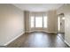 Inviting living room with large bay windows offering plenty of natural light and beautiful wood flooring at 5105 Cascade Hills Cir, Atlanta, GA 30331