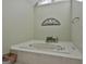 A large soaking tub and neutral tones make this bathroom feel relaxing at 208 Pinnacle Ct, Peachtree City, GA 30269