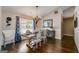 Elegant dining room featuring hardwood floors, a stylish chandelier and plenty of natural light at 305 Cranmore Pl, Villa Rica, GA 30180