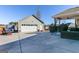 Exterior featuring a detached garage, covered patio with outdoor seating and a driveway at 305 Cranmore Pl, Villa Rica, GA 30180