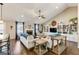 Bright living room featuring hardwood floors, a cozy fireplace, and stylish built-in shelving at 305 Cranmore Pl, Villa Rica, GA 30180