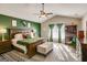 Spacious main bedroom with a vaulted ceiling, neutral walls, plush carpet and green accent wall at 305 Cranmore Pl, Villa Rica, GA 30180