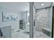 Modern bathroom featuring a glass enclosed shower with gray tile and a white vanity at 5997 Wildcreek Rd, Sugar Hill, GA 30518