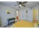Comfortable bedroom with bright windows, a desk area, and a doorway to the en suite at 5997 Wildcreek Rd, Sugar Hill, GA 30518