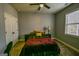 Cozy bedroom featuring neutral walls, plush carpet, and double door closet at 5997 Wildcreek Rd, Sugar Hill, GA 30518