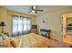 Comfortable bedroom with bright windows, patterned curtains, and a cozy desk area at 5997 Wildcreek Rd, Sugar Hill, GA 30518