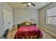 Cozy bedroom with carpet, double closet, and natural light from the window at 5997 Wildcreek Rd, Sugar Hill, GA 30518