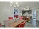 Charming dining area with a wooden table, adjacent to a kitchenette and a cozy living space at 5997 Wildcreek Rd, Sugar Hill, GA 30518