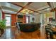 Cozy living room with a stone fireplace, a trey ceiling and hardwood floors at 5997 Wildcreek Rd, Sugar Hill, GA 30518