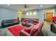 Spacious living room with comfortable seating, a plush rug, and an inviting atmosphere for relaxation at 5997 Wildcreek Rd, Sugar Hill, GA 30518