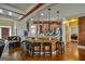 Open layout with breakfast bar with seating, view to kitchen and living area with fireplace at 5997 Wildcreek Rd, Sugar Hill, GA 30518